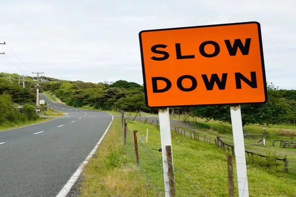 Being in a hurry is not an excuse to violate traffic rules slow down sign