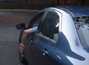 Hand signal for stop in a car