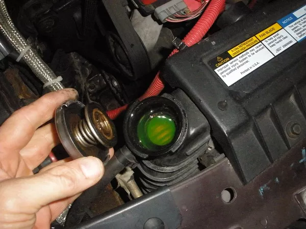 Make sure the vehicle's coolant topped off to the indicated maximum level vehicle's coolant