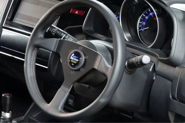 A picture of a car's steering wheel.