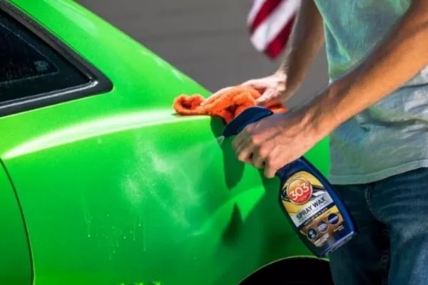 Easy peasy lemon squeezy A picture of a man apply a spray on wax