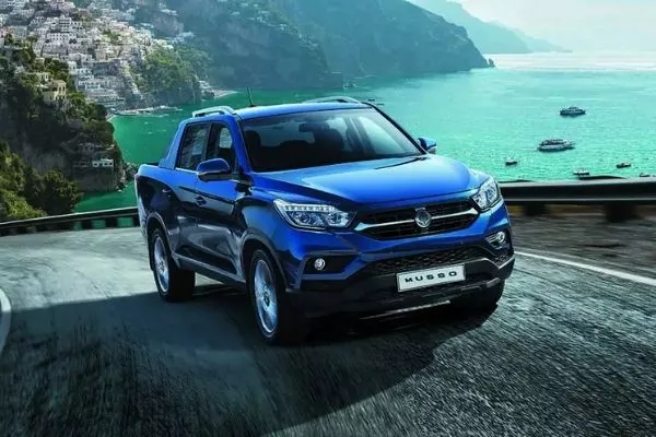 An unsung pickup truck that can surely deliver A blue Musso climbing up a mountain