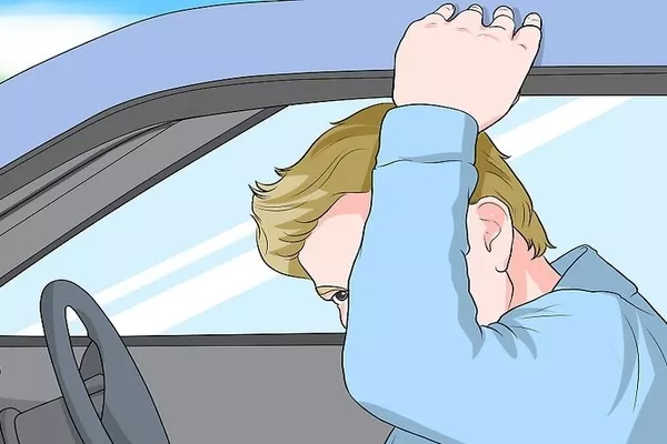 Man touching the roof of the car