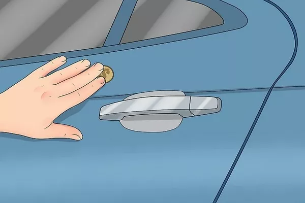 Man holding coin while touching the car