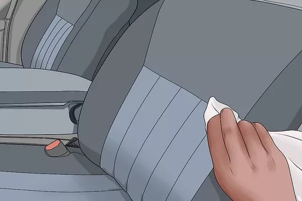 Man wiping the car seat