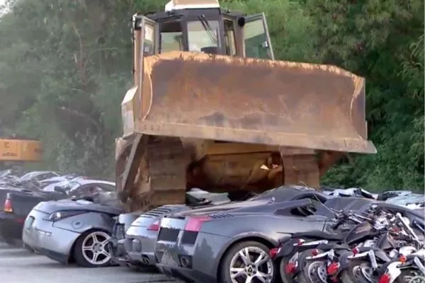 A picture of supercars being destroyed by the Philippine government