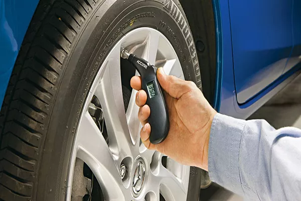 Man checking car tires