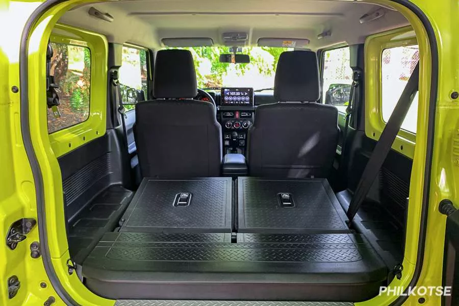 A picture of the Jimny from the rear with the seats folded