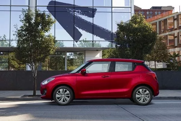 And yes, the Swift is inherently a well sculpted car that's very easy on the eyes A picture of the side profile of the Suzuki Swift while parked in the city