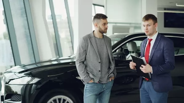 talking to car dealer