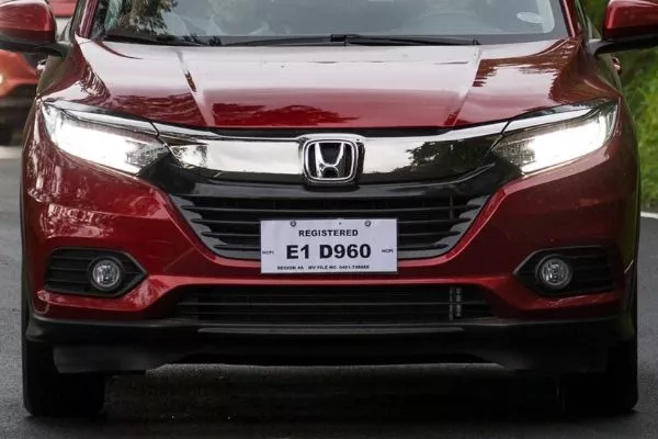 If a license plate is not yet available, a temporary plate will do. Also, don't forget a copy of your car's OR and CR A picture of a Honda CR-V with a temporary plate.