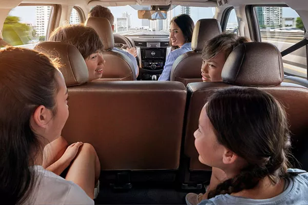 A picture of the the interior of the Nissan Terra full of kids