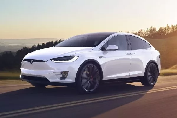 A Model X running down a road