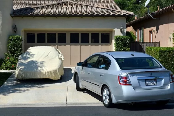 two cars in a driveway