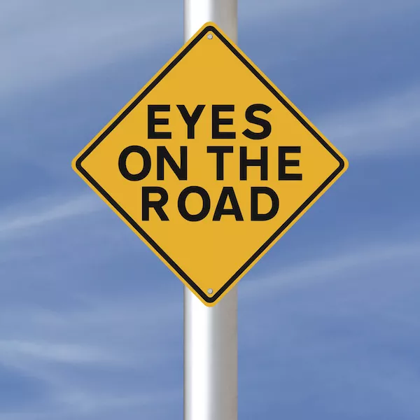 Always drive with utmost focus and avoid being disctracted Eye on the road sign