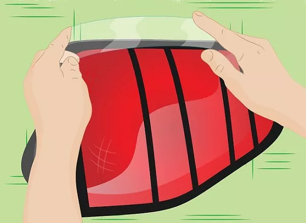 Man putting tape on the LED light