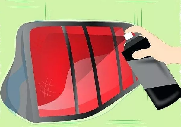 Man spraying the tail light