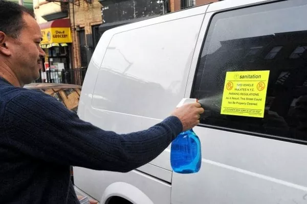 Man spraying the car window