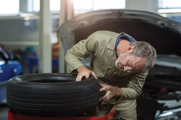 Mechanic checking the tire