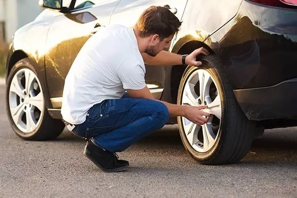 Man touching the wheel