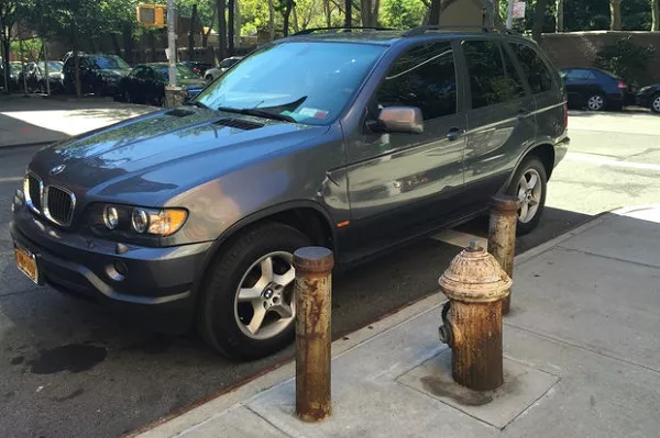 Car parked near a fire hydrant