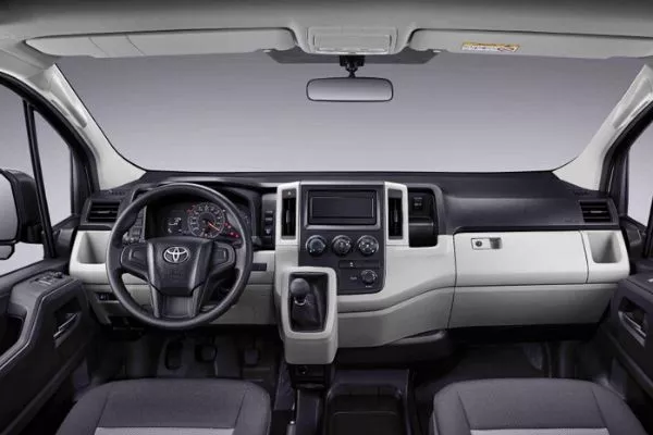 A picture of the interior of the Commuter Deluxe highlighting the dashboard