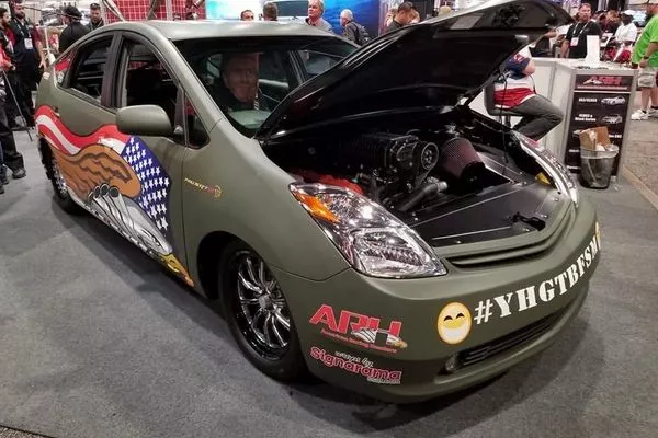 Check-out the paint scheme. Very tongue in cheek right? A picture of the Hellcat V8 swapped Toyota Prius