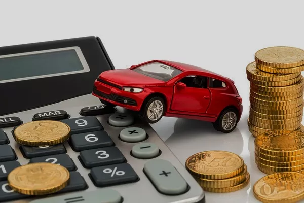 calculator, toy car and some coins