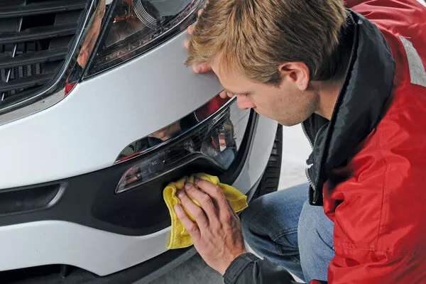 man cleaning the car interior