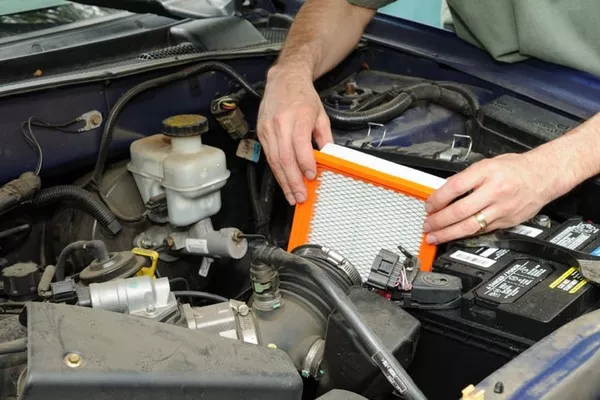 man changing the air filter
