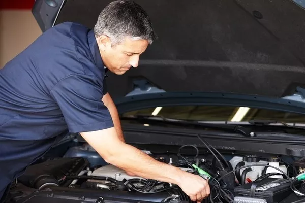 Man checking the car engine