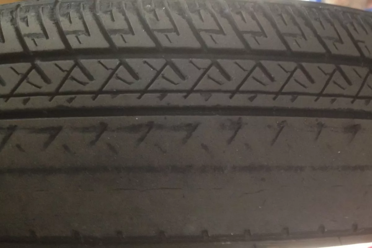 A picture of a tire with uneven wear
