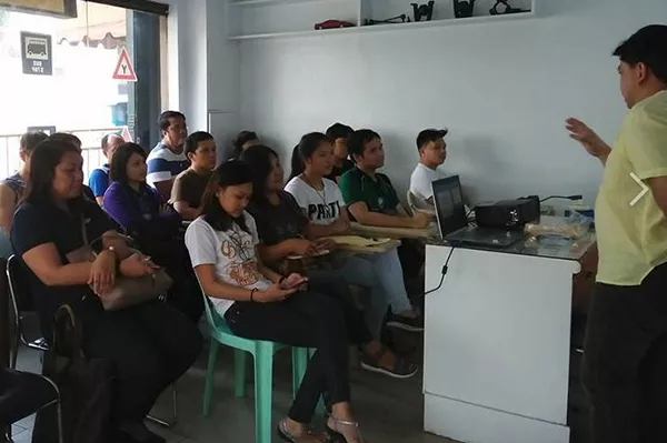 A picture of Universal Driving School students listening to a lecture