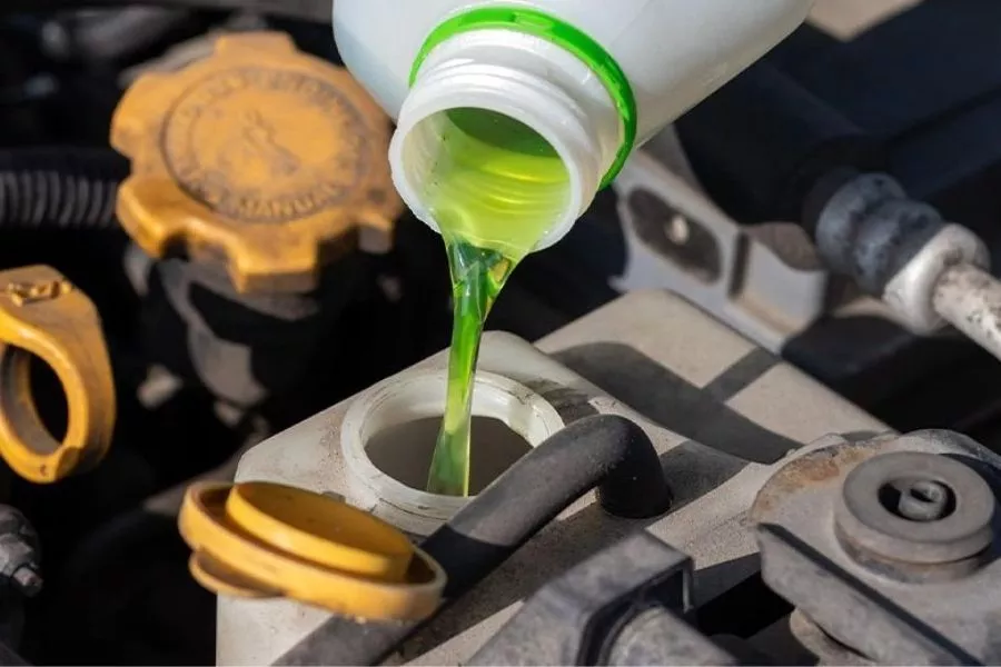 Pouring coolant into tank