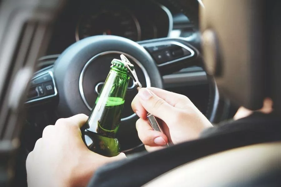Beer bottle behind the wheel 