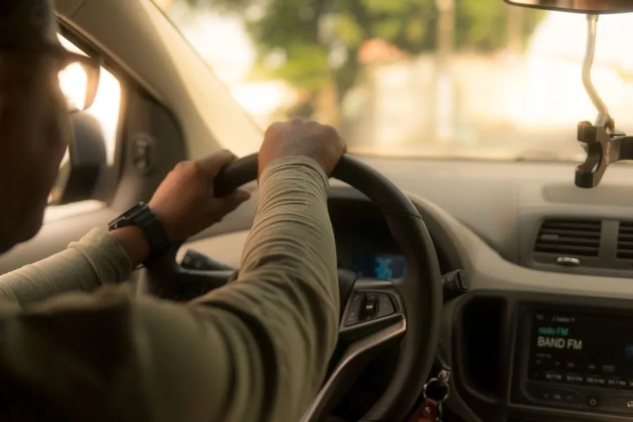 Driver holding steering wheel