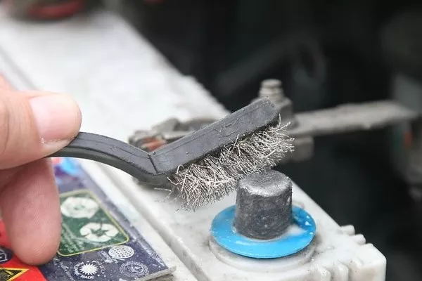 Brushing the car battery terminals