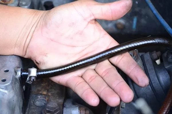 Man checking the hose for tears and leaks