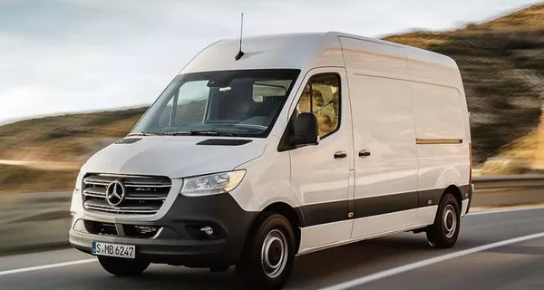 a white panel van on the road