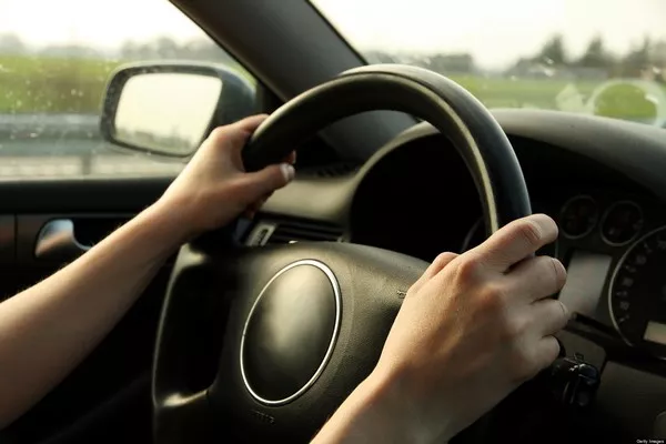 Man holding the steering wheel