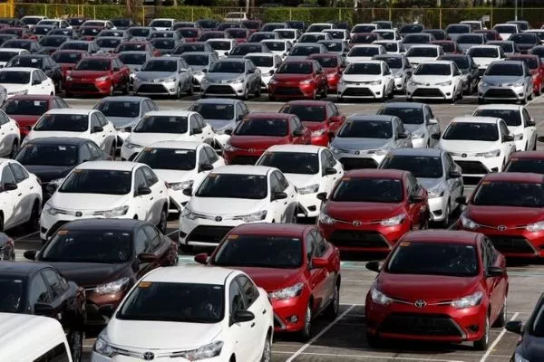 A picture of Toyota Vios units in a dealership lot.