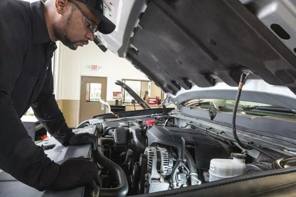 mechanic checking the engine