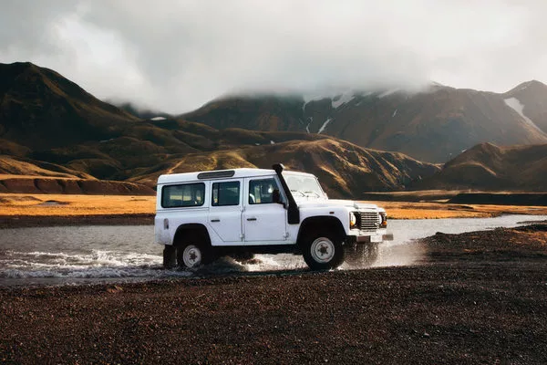 White car in a rocky terrain