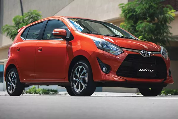 A picture of a Toyota Wigo parked on someone's driveway