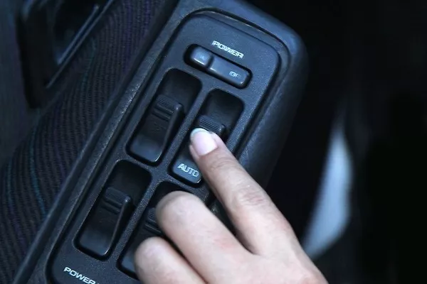 Push the buttons that control the movement of your windows. Electric window buttons