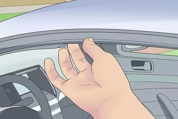 The window seals and gasket are responsible for keeping external weather elements out of your car. Man checking the car window