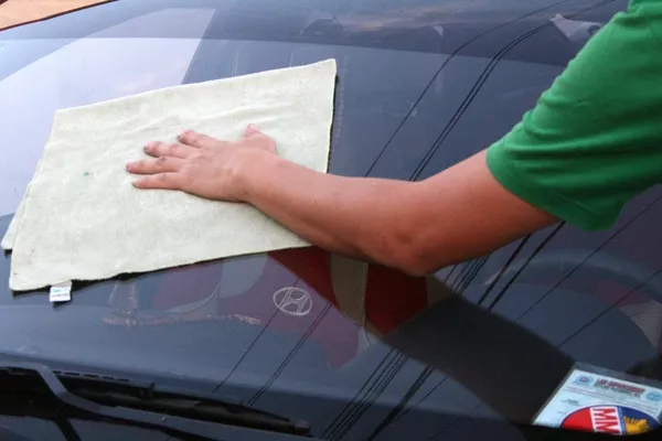 Man wiping the windshield