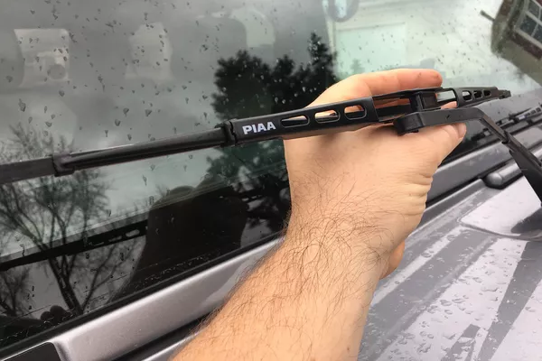 Man lifting the wipers up 