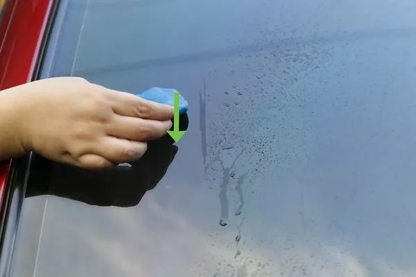 Man wiping the windshield 