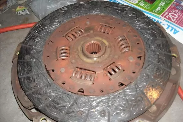 A years old clutch disc like this can't grab anything A picture of a very worn car clutch